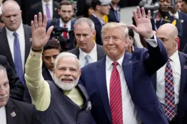 Indian Prime Minister Narendra Modi and then-President Donald Trump wave to a large crowd during the 'Howdy Modi' event in Houston, Texas, in September 2019